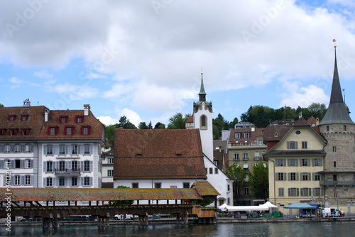Medieval old town of Lucerne with famous Kappelbrücke (Chapel Bridge) on a cloudy summer day with river Reuss. Photo taken June 22nd, 2021, Luzern, Switzerland.