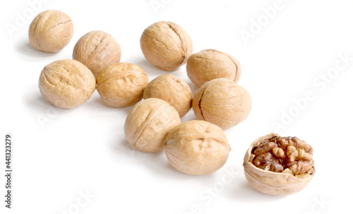 Walnuts in shell and one shelled isolated on white background