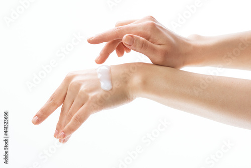 female hands applying cream moisturizing cosmetics massage