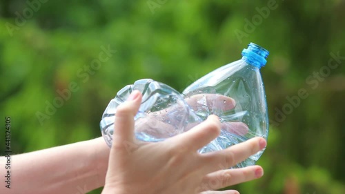 Wallpaper Mural Crushing the plastic bottle with hands in 4k slow motion 60fps Torontodigital.ca