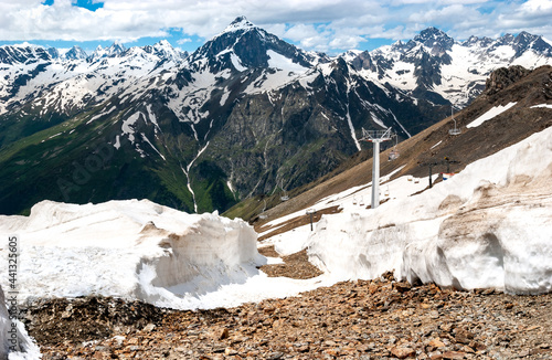 Snow melts on the slopes of Dombay, the majestic mountains of the Caucasus. Russia.
