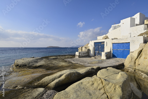 Typical white houses on the rocks of the small fishing village of Karras on the Greek island of Kimolos photo