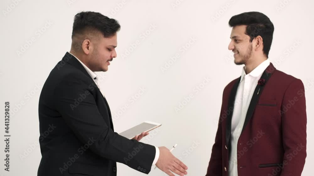 Two men in official costumes discussing something isolated Two men in official costumes discussing something isolated