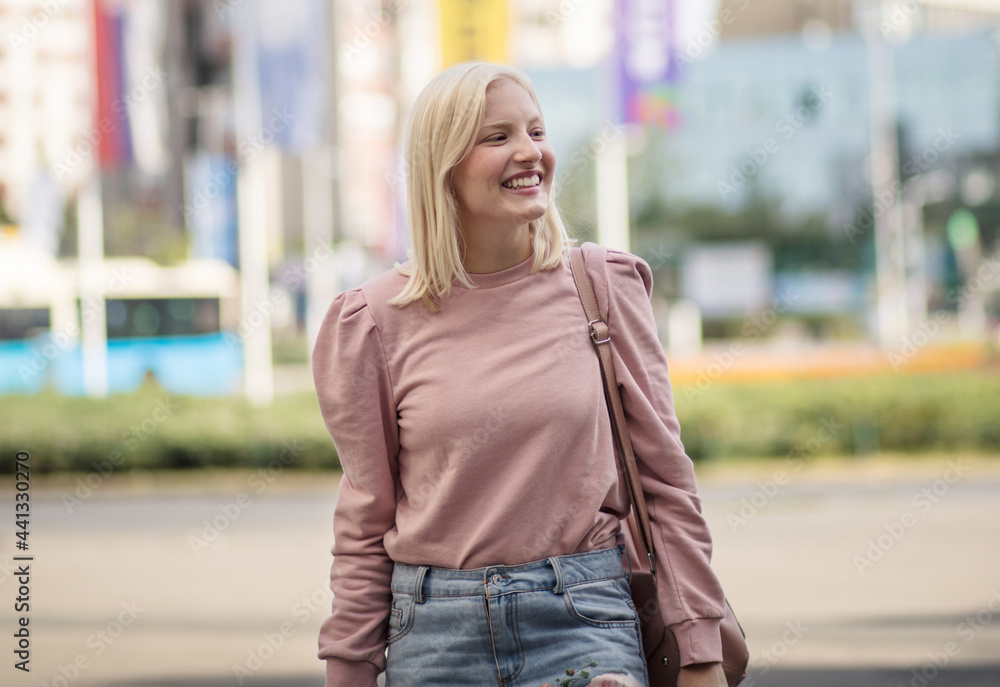 Smiling woman in the city.
