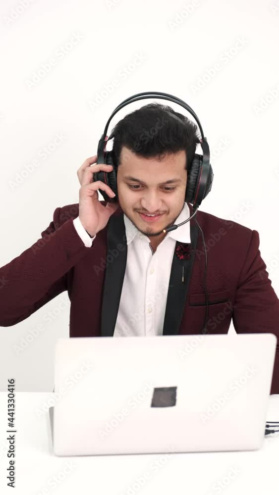Indian businessman working at desk in office Indian businessman working at desk in office