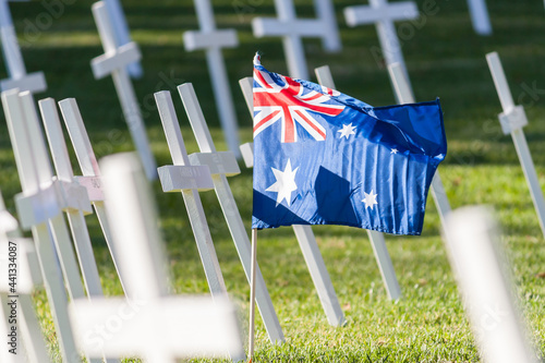 An Australian flag amongst a group of crosses photo