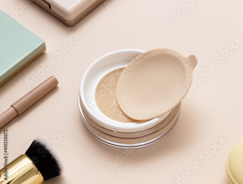 Women's secrets. Decorative cosmetics: powder ,brush, face sculpture . Make up