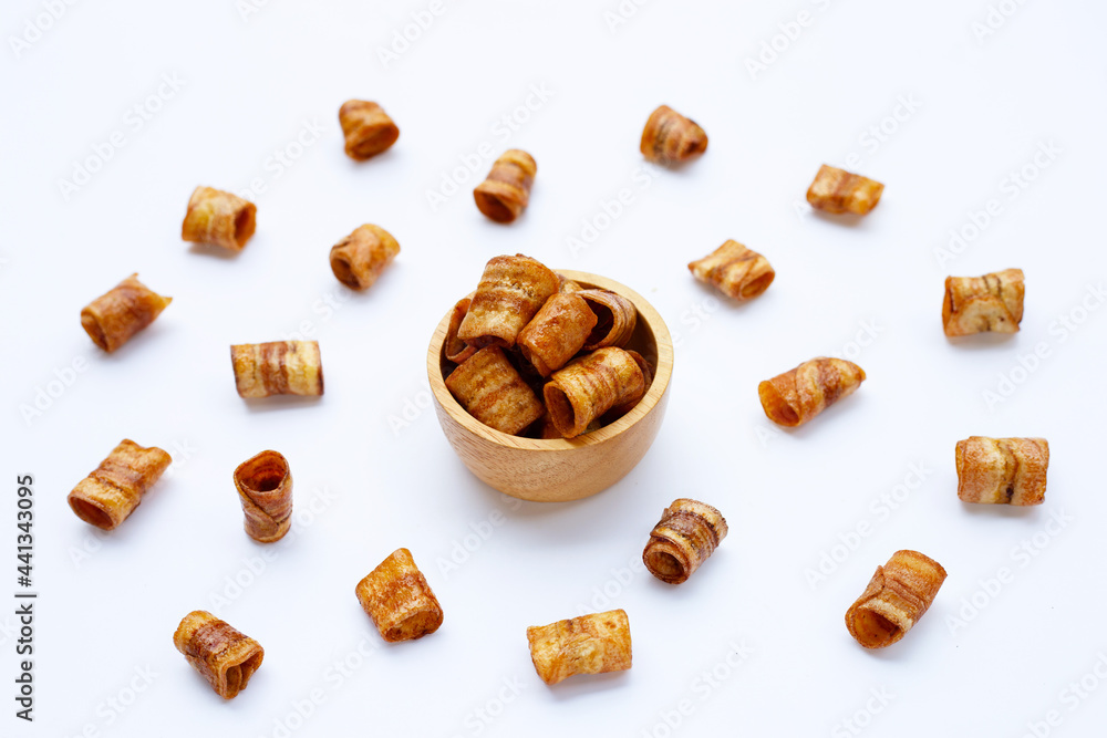 Dried banana rolled chips on white. Dried banana rolled chips on white.