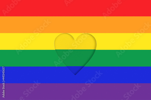 LGBTQ pride flag background. Rainbow Printed cardboard with die-cut heart shape