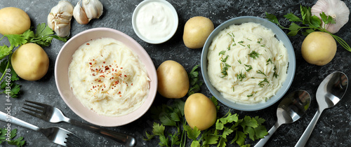 Obraz na płótnie Concept of tasty eating with mashed potatoes on black smokey table