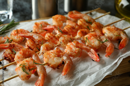 Concept of tasty eating with grilled shrimps, close up