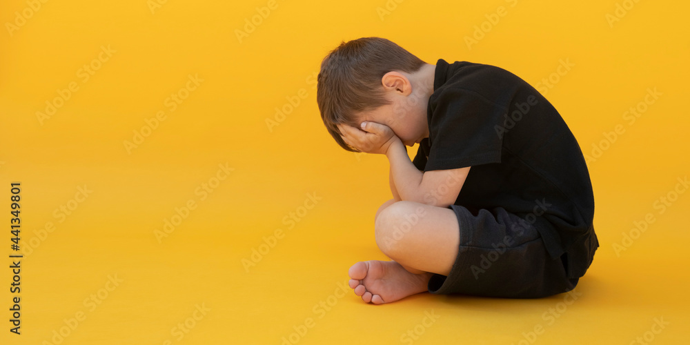 child whose depression is sitting on the color floor child whose depression is sitting on the color floor
