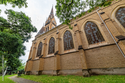 Backa Topola, Serbia - June 06, 2021: Roman Catholic Church of the Immaculate Virgin Mary in Backa Topola. It has the tallest tower in Eastern Europe 72.7m photo