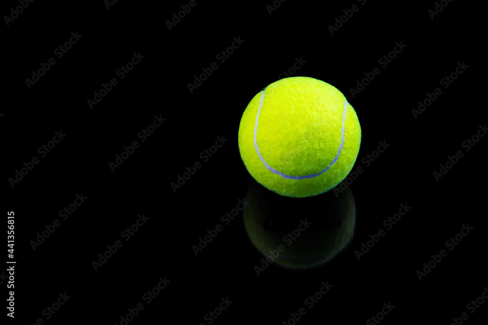tennis ball isolated on black with reflection