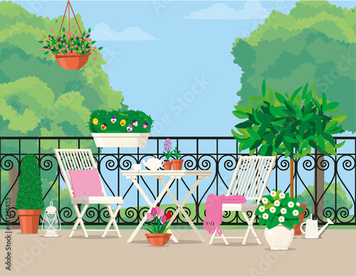 White garden furniture on the balcony with a green view.