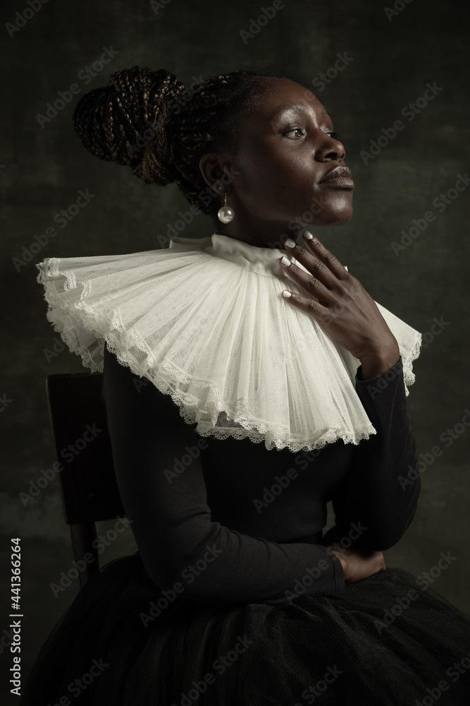 Close-up portrait of medieval African young woman in black vintage ...