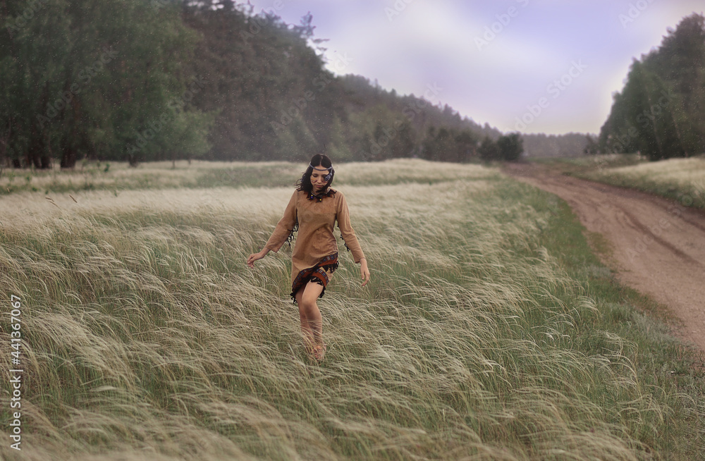 A Latin American girl walks in the field A Latin American girl walks in the field