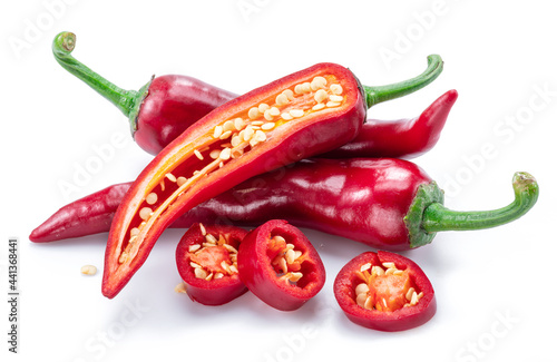 Fresh red chilli pepper and cross sections of chilli pepper with seeds isolated on white background.