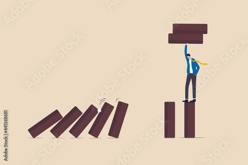 Risk management, protect business from disaster or crisis, leadership to avoid losing money, problem and failure concept, smart businessman company leader remove domino to stop domino effect collapse.