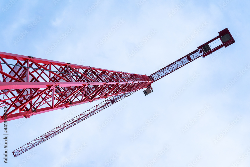 Single construction crane close-up at BudaPart construction site in twilight near to MOL Campus building, Kopaszi-gát. Single construction crane close-up at BudaPart construction site in twilight near to MOL Campus building, Kopaszi-gát.
