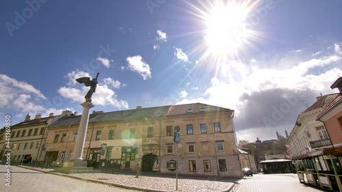 Static footage of empty Uzupis district with its symbol Statue of The Angel against the sun photo