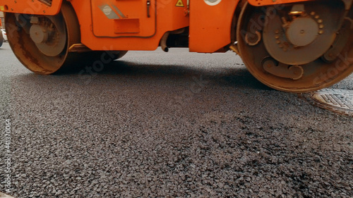  Heavy asphalt road roller with heavy vibration roller compactor that press new hot asphalt © nimito