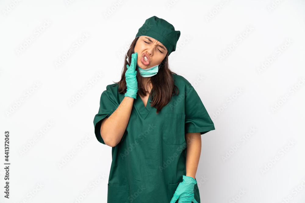 Surgeon woman in green uniform isolated on white background with toothache Surgeon woman in green uniform isolated on white background with toothache