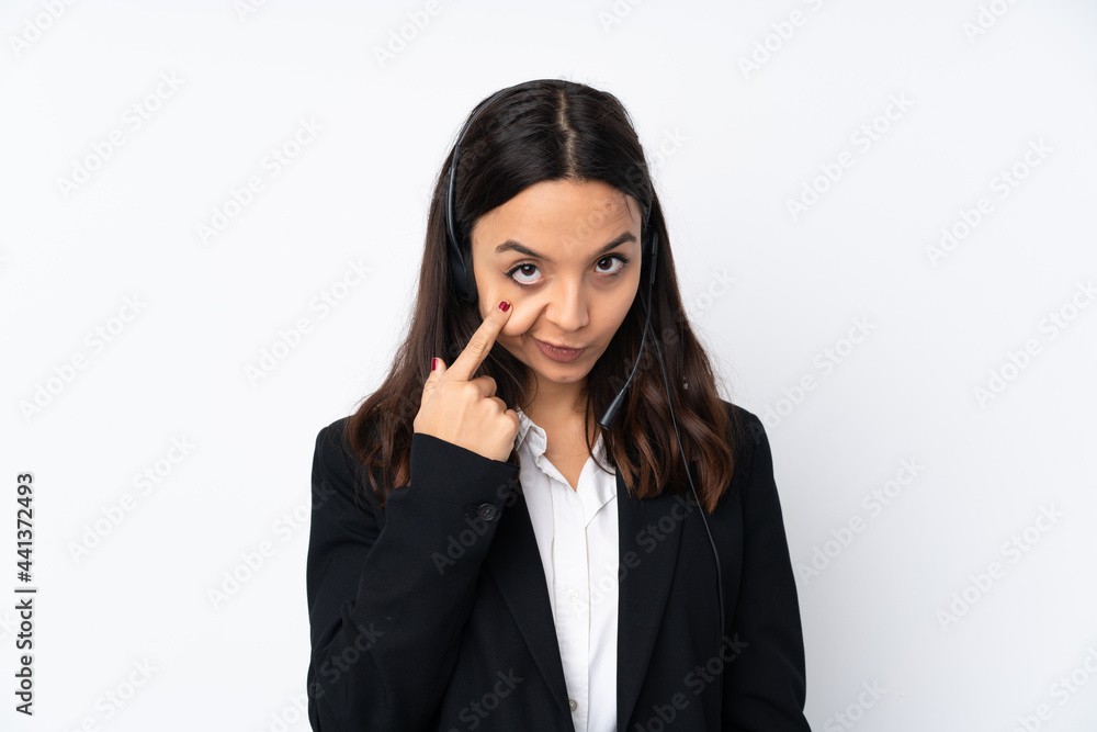 Young telemarketer woman isolated on white background showing something Young telemarketer woman isolated on white background showing something