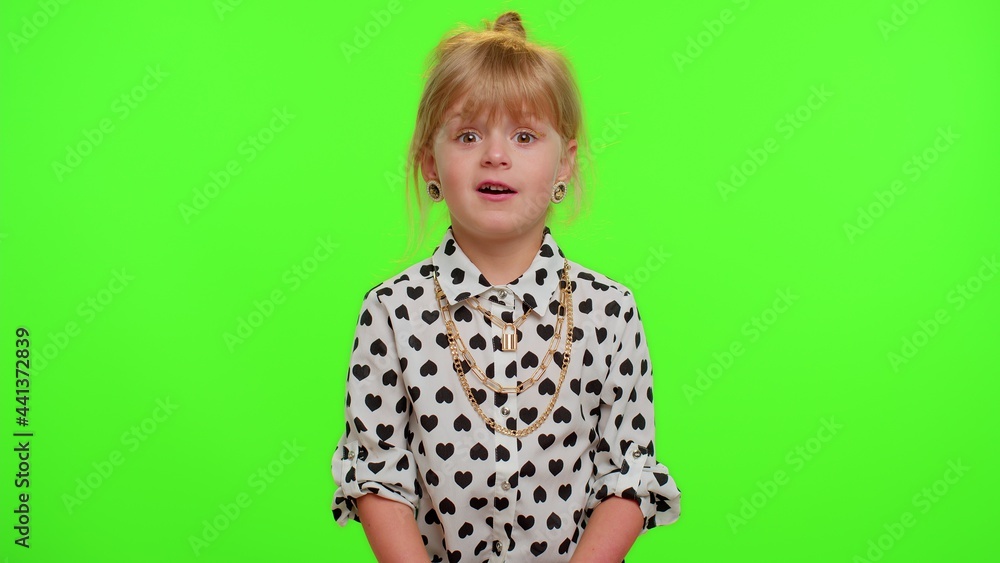 Oh my god, wow. Excited amazed blonde child girl 5-6 years old raising hands in surprise looking at camera with big eyes, shocked by sudden victory on chroma key green background. Teen kid children Oh my god, wow. Excited amazed blonde child girl 5-6 years old raising hands in surprise looking at camera with big eyes, shocked by sudden victory on chroma key green background. Teen kid children