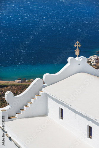 The church of Kioura in the white village of Kardiani overlooking the south coast of the Greek island of Tinos in the Cyclades archipelago photo