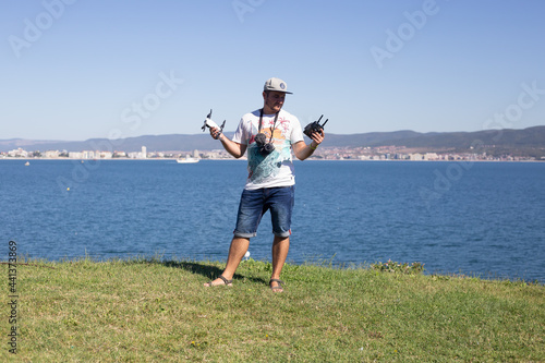 man blogger with video and photo cameras in his hands, in Bulgaria, Nessebar