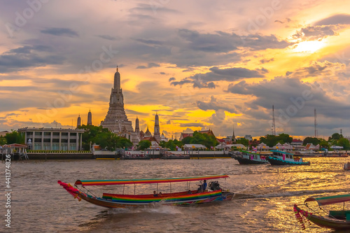 sunset over the river at wat Arun Bangkok Thailand.