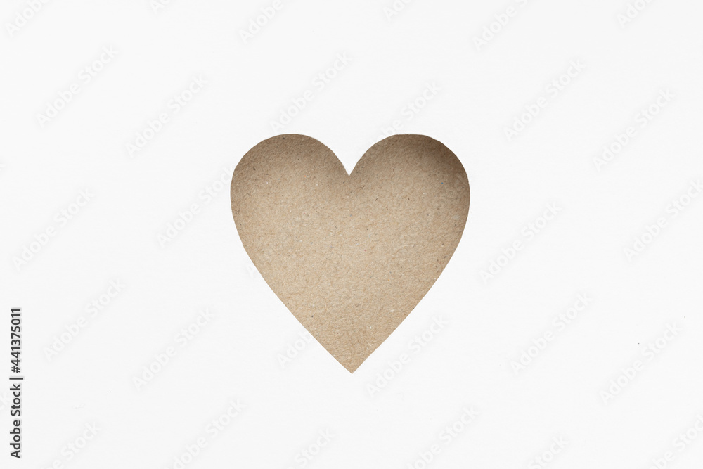 Die-cut Cardboard Heart shaped isolated on white paper background. Love concept
