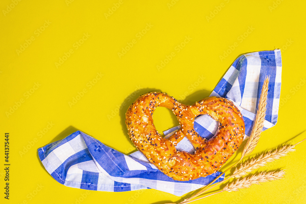 Oktoberfest concept - pretzel on a traditional napkin Oktoberfest concept - pretzel on a traditional napkin