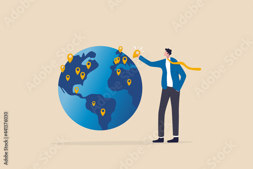 Global business expansion, open company branches, franchise in new location to cover all continent, growing business worldwide concept, businessman CEO put new branch pin on world map across globe. photo