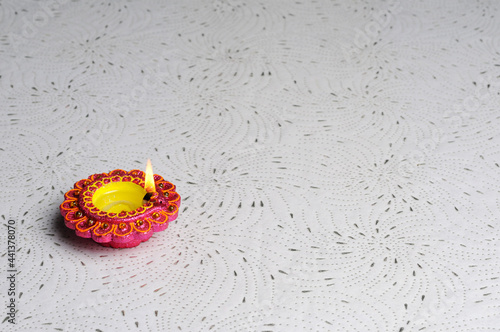  decorative Clay diya or Oil Lamp lit during diwali festiva