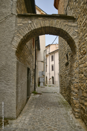 Fototapeta Naklejka Na Ścianę i Meble -  A small street between the old houses of Agnone, a medieval village in the mountains of the Molise region, Italy.