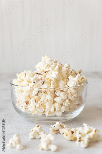 Popcorn in a bowl on grey background