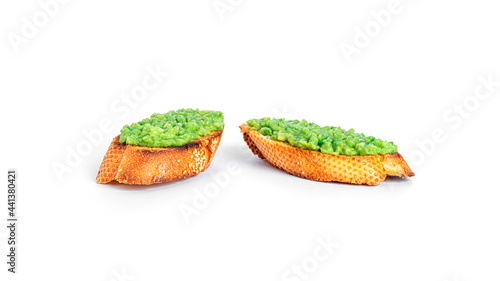 Sandwich with guacamole isolated on a white background. Bruschetta with avocado. Healthy breakfast.