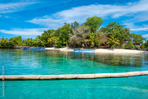 Fototapeta Naklejka Na Ścianę i Meble -  White sandy beach of Poyalisa as part of the Togian Island in the Gulf of Tomini in Sulawesi. The Islands are a paradise for divers and snorkelers and offers an incredible diversity of species