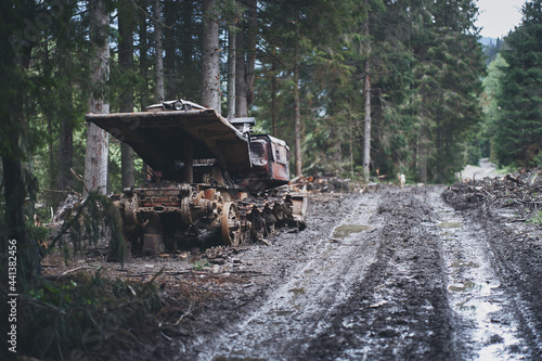Old rusty abandoned forestry equipment. Ukrainian Carpathian mountains.