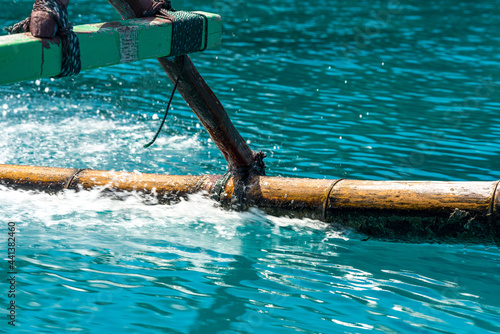 Close-up of an outrigger from a speed boat by a trip in the Togian Islands. Outrigger are used to used to stabilise an inherently unstable main hull photo