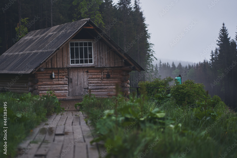 Old abandoned wooden house in the mountains. Ukrainian Carpathian mountains. Old abandoned wooden house in the mountains. Ukrainian Carpathian mountains.