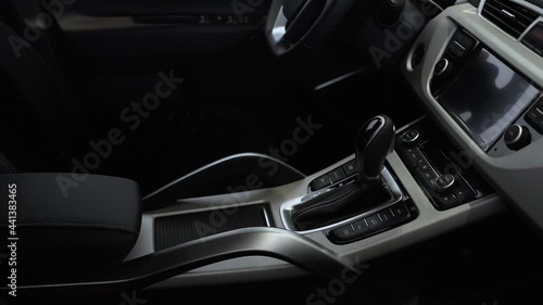 The interior of a luxury car with leather upholstery seats.