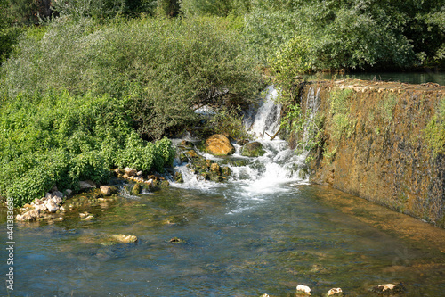 Dam, river and small waterfalls near a road in province of Fronzinone in Italy photo