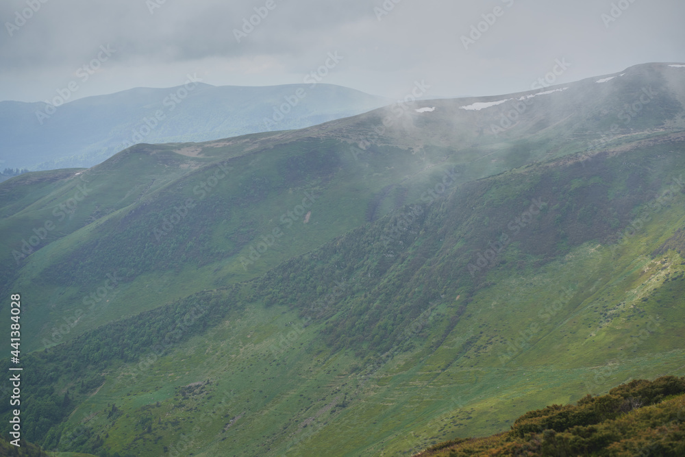 Low clouds and fog over the mountains. Svidovets ridge. Ukraine, Carpathian mountains. Low clouds and fog over the mountains. Svidovets ridge. Ukraine, Carpathian mountains.