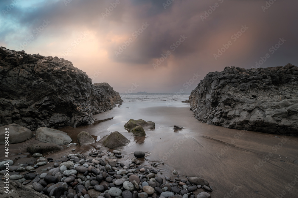 Seascape. San Felipe beach view in a cloudy sunset. Santa María de Guía. Canary Islands