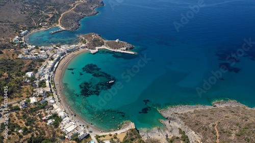 Aerial drone photo of beautiful twin bay, beach and small village of Kapsali  below iconic castle of Kythera island, Ionian, Greece © aerial-drone