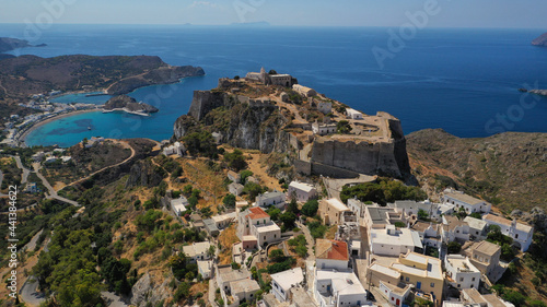 Aerial drone photo above iconic medieval castle and main village of Kithira island overlooking beautiful double bay and beach of Kapsali, Kythira island, Ionian, Greece