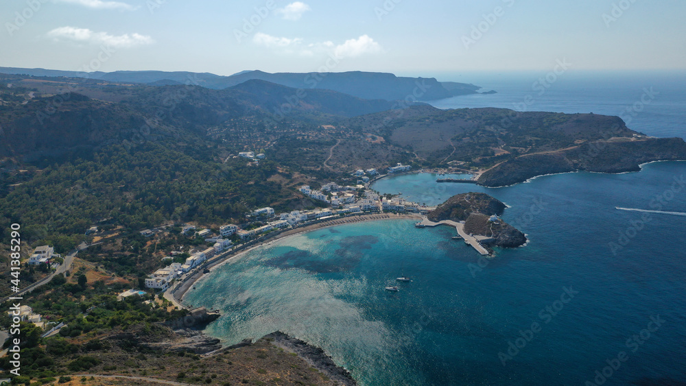 Aerial drone photo of beautiful twin bay, beach and small village of Kapsali  below iconic castle of Kythera island, Ionian, Greece